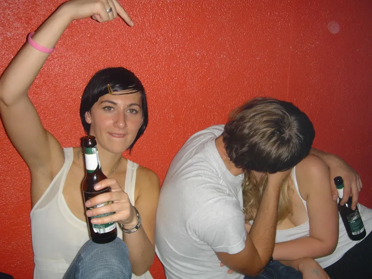 A party in front of a red wall