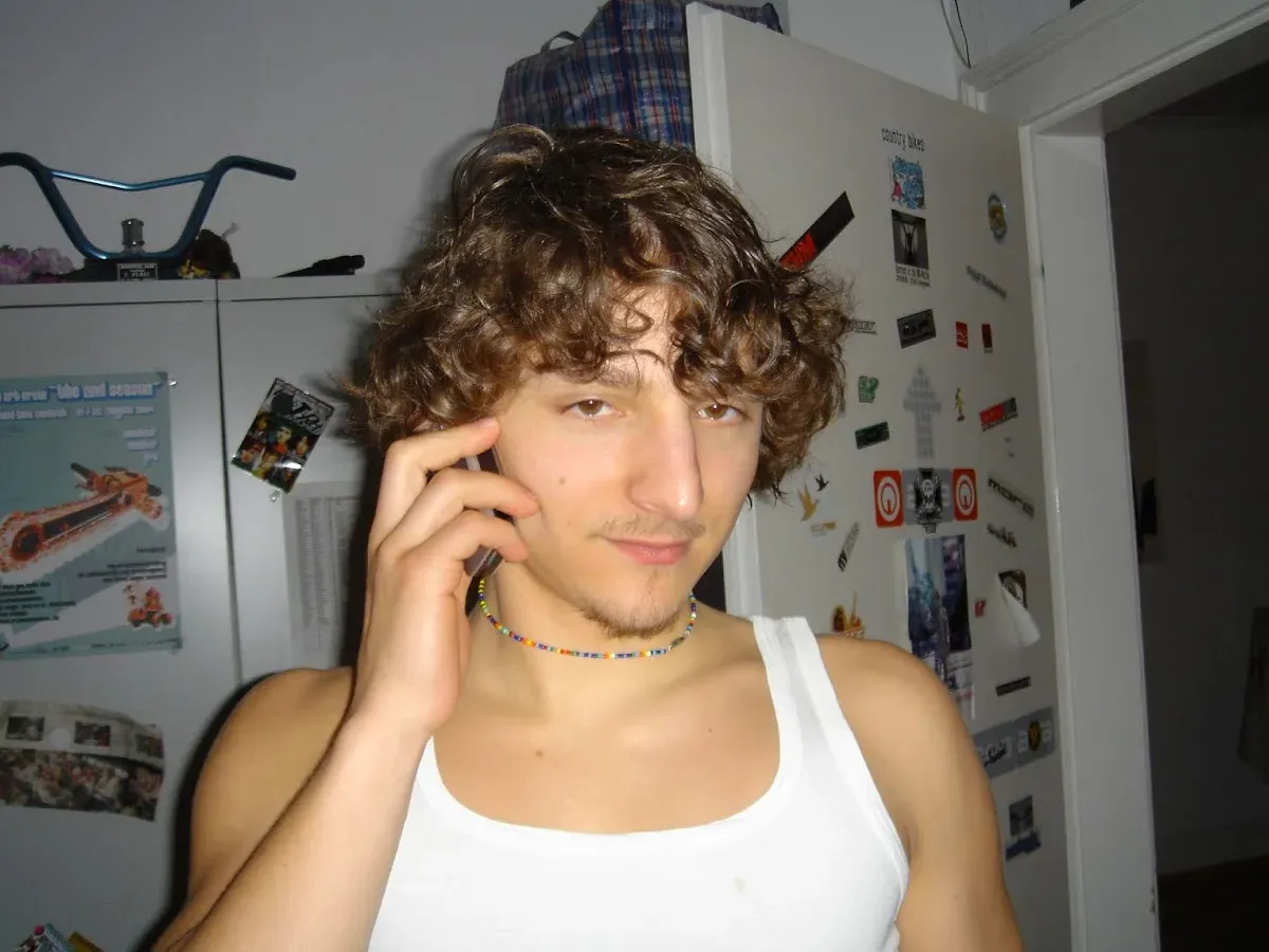 Seppl on the phone in the flat