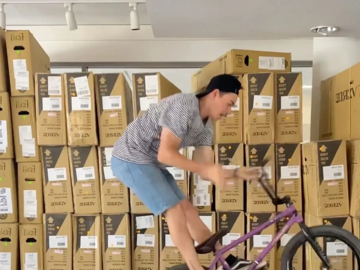 A wall of stacked bike cartons in the warehouse