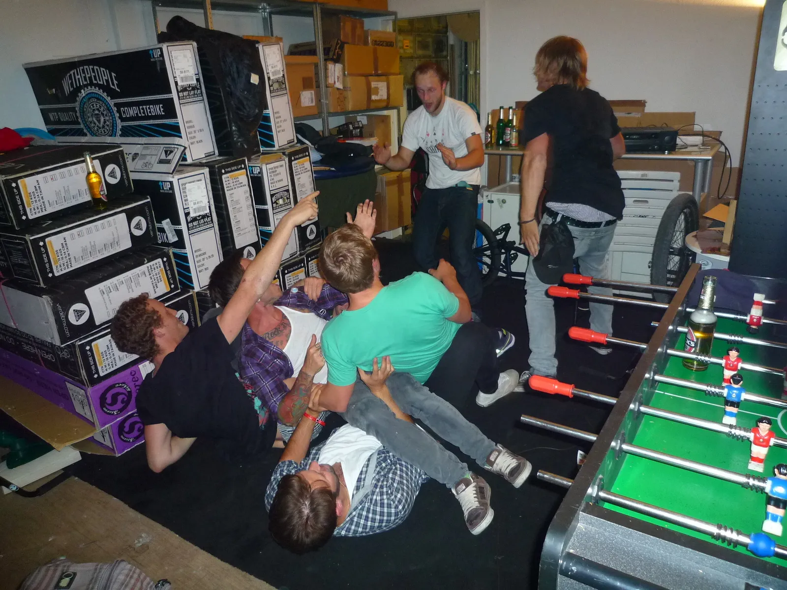 Party at the table football in the stockroom, between the wethepeople boxes, 2010