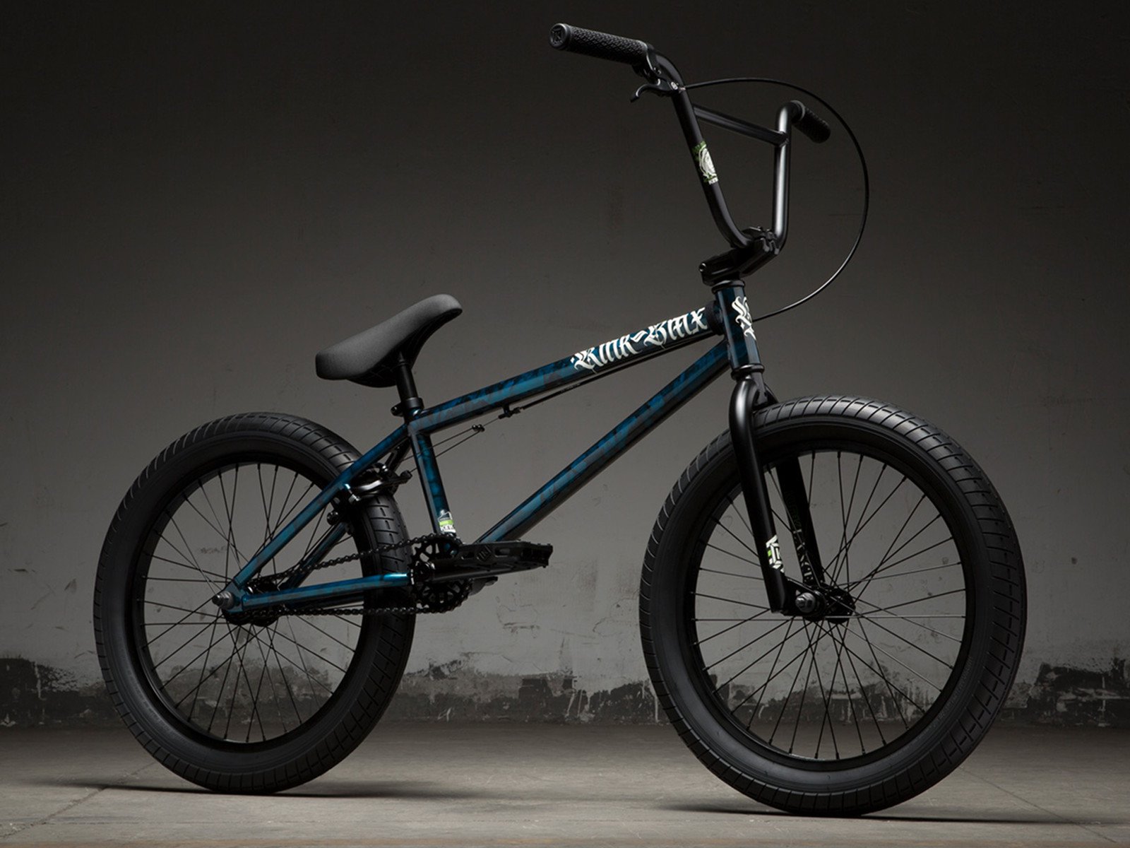 black and teal bmx bike